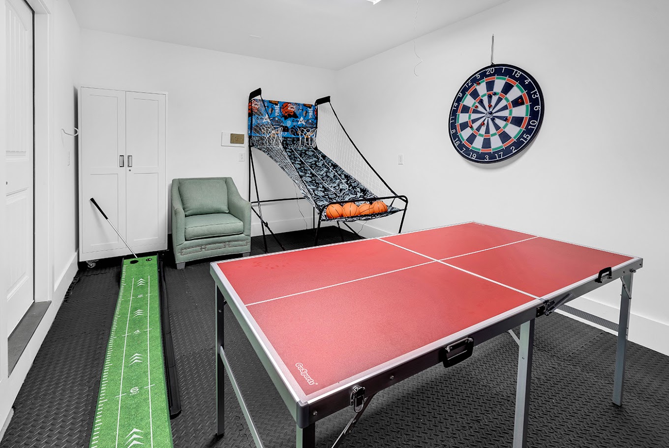 Game room with ping pong, basketball shoot, putting green and darts