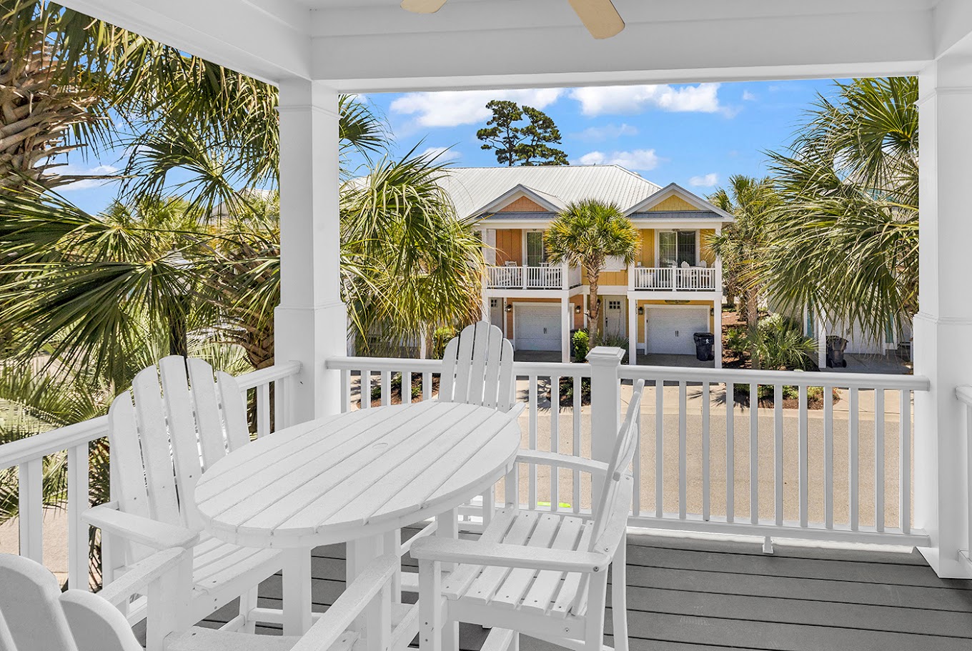 Balcony with Adirondack chairs and palm trees
